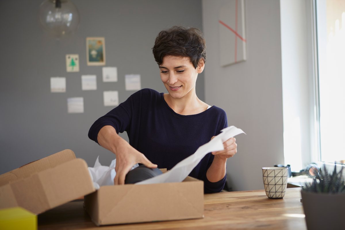 Packing personal items into moving boxes